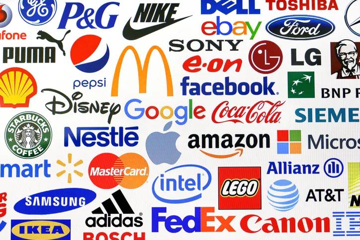 Novi Sad, Serbia - February 24, 2016: Photo of a logotype collection of some of most famous brands in the world on a screen - including Coca-Cola, Nestle, Nike, McDonald's, Google, Facebook, Microsoft, Sony, Apple and promotional products