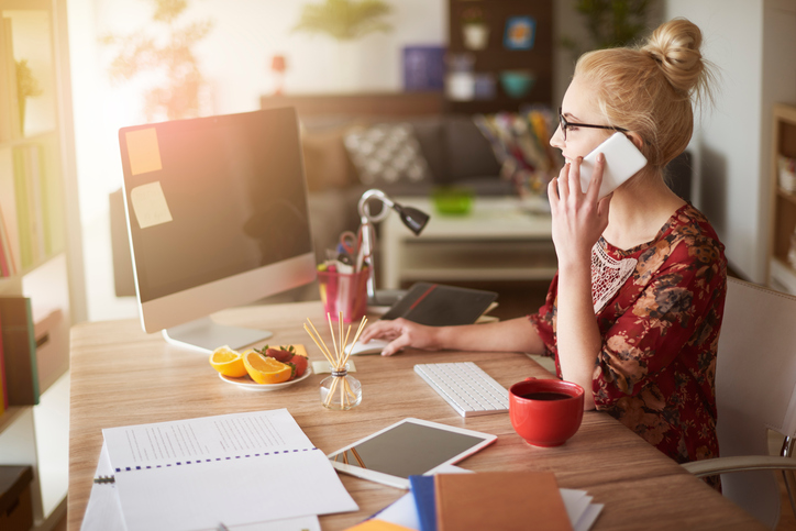Small business owner in surroundings of digital technology.